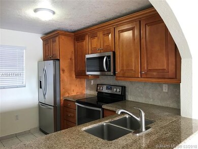 Beautiful Kitchen with Granite top, wood cabinets,