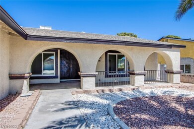 Walkway to the Arched Wide Porch with Double Gated