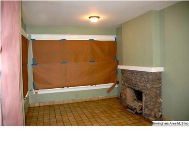 SUNROOM HAS TILE FLOOR & SECOND FIREPLACE