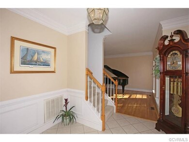 Front, entry Foyer w/ tile floor and wainscoting.