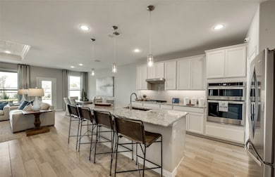 Spacious eat-in kitchen designed with a large island for dining *Model representation
