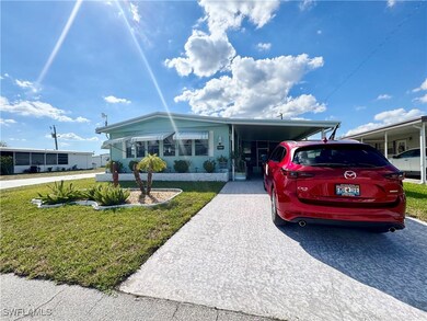 Manufactured / mobile home featuring a carport and