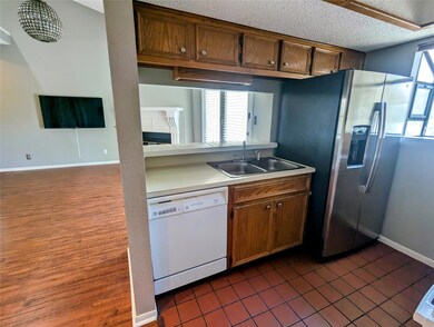 Kitchen with dishwasher, a sink, stainless steel 