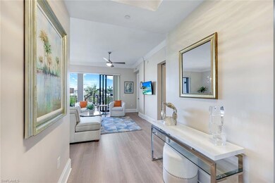 Hallway with light wood-style flooring, baseboards