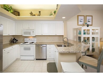 Raised panel cabinets, tile backsplash and granite countertops