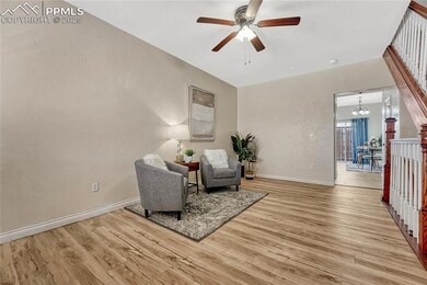 Sitting room with baseboards, wood finished floors