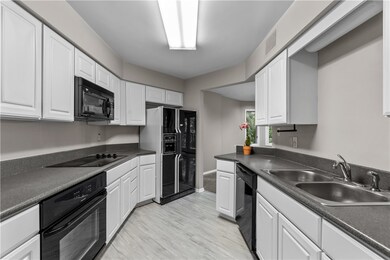 Beautiful equipped kitchen with vinyl flooring.