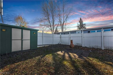 Yard at dusk featuring a shed