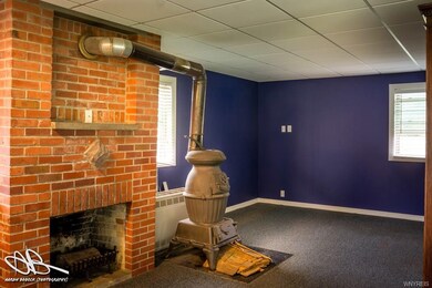 Either gas wall furnace or woodburning air tight s