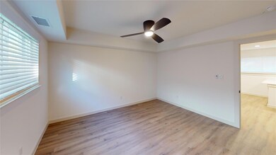 Spare room with baseboards, visible vents, ceiling