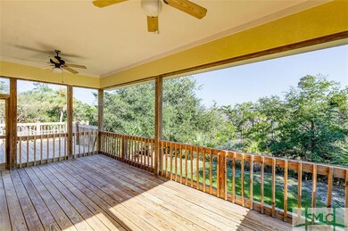 Covered back deck w/ view of marsh.
