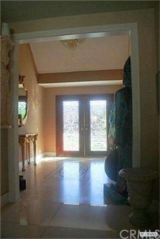 Addition to homes entrance with BEAUTIFUL glass doors and tastefully designed flooring with medallion in center for a WOW entrance