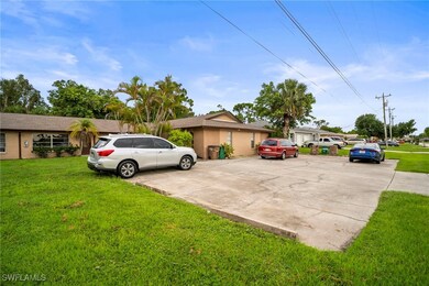 View of front of home with a front yard and stucco