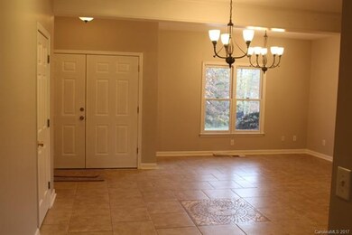 Double front door and beautifully tiled floors in 