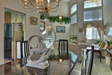 Home features soaring ceilings, neutral decor thro