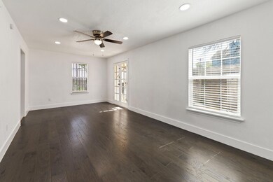 Spare room featuring a ceiling fan, baseboards, da