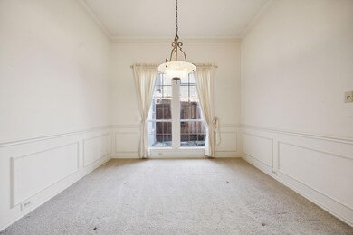 Formal dining room with view to private side patio