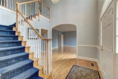 Foyer has handsome staircase.  Foyer nicely connec