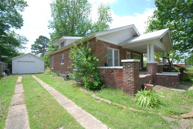 Side view, full brick, large covered porch,detache