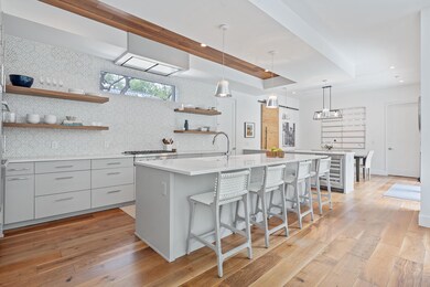 Kitchen with gray cabinets, a center island with 