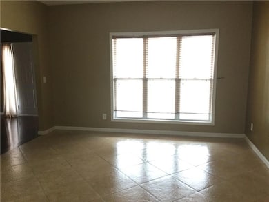 Unfurnished room featuring tile patterned floors a