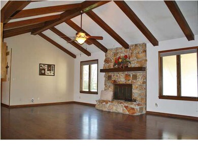 Beautiful wood beams adorn the entire vaulted livi
