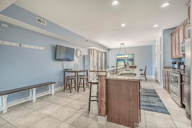 Kitchen with a kitchen bar, sink, hanging light fi