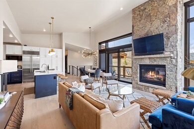 Living room featuring high vaulted ceiling, light