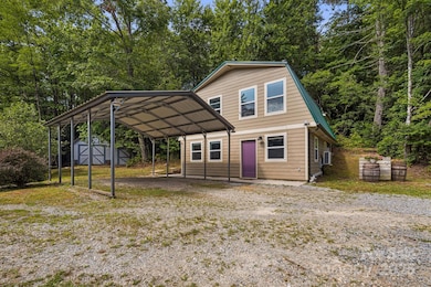 Front of home with double (portable) carport