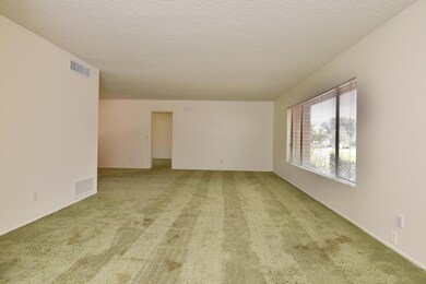Living room with large front window.
