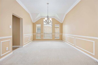 Beautiful & bright formal siting with chair railing