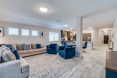Living room with light wood-type flooring and visi