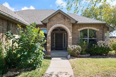 Doorway to property with a yard