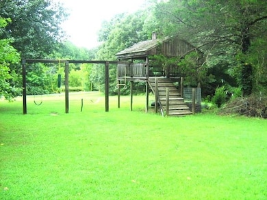 Playhouse with swing set