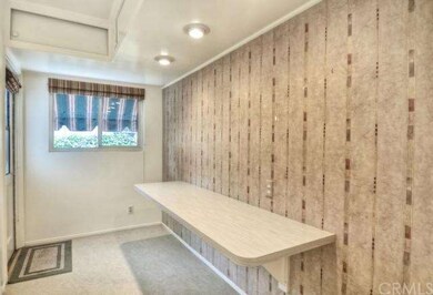 Breakfast bar in kitchen; note side door to rear p
