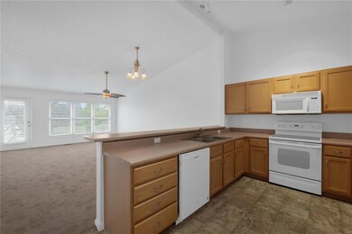 Vaulted ceilings throughout kitchen, living & dini