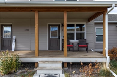 Entrance to property featuring a porch