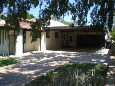 Carport and 2 car garage.