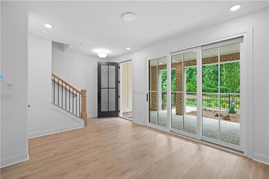 An elegant 4 panel glass door creates a striking entry to the media/flex room & a large sliding glass door fills the space with natural light and provides easy access to the outdoor patio, creating a seamless indoor-outdoor connection. Ideal for rela