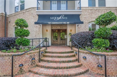 Doorway to property featuring french doors and brick siding
