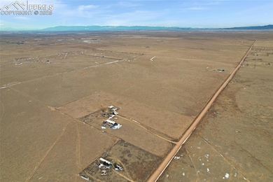 Birds eye view of property featuring a rural view 
