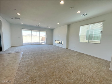 Spare room with light colored carpet and recessed