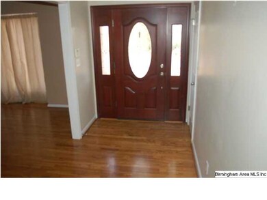 Foyer with hardwood floors.