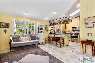 KEEPING ROOM AND KITCHEN WITH DOOR TO BACKYARD ARE
