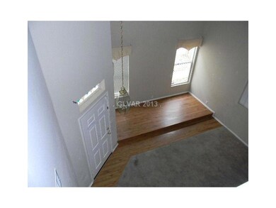 Living Room. VIEW OF THE ENTRY FOYER AND LIVING RO