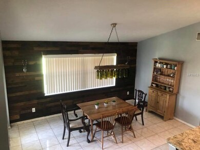 Volume ceiling, tile floor and beautiful accent wa