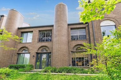 Lush landscape surrounds the front door