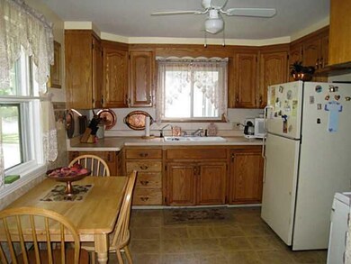 Kitchen Oak eat-in kitchen with vinyl flooring