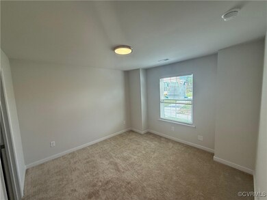 Empty room with baseboards, light colored carpet,