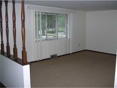 Living Room. New carpeting and freshly painted.